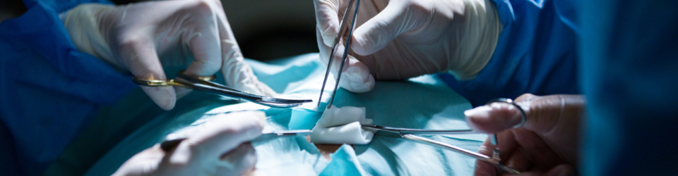 Surgeons performing operation in operation room at the hospital